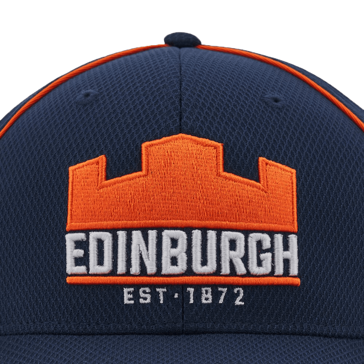 The Edinburgh Baseball Cap 24/25 by Macron features a navy blue design with orange and white embroidery that highlights "EDINBURGH" and "EST. 1872" below an orange castle motif, combining classic style with heritage charm.