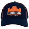 Edinburgh Baseball Cap 24/25 by Macron with orange trim, featuring an orange castle logo and "Edinburgh" in white, along with "Est. 1872." Perfect for Edinburgh Rugby fans looking to show their team spirit.