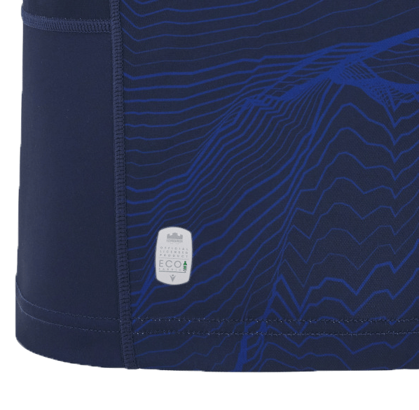 Close-up of a navy blue fabric featuring abstract wave patterns, inspired by the Edinburgh 24/25 Replica Home Jersey by Macron, with an ECO label on the side.