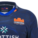 The Edinburgh 24/25 Replica Home Jersey by Macron is a navy blue shirt with orange and white lettering and logo, showcasing "EDINBURGH EST. 1872" and "SCOTTISH BUILDING SOCIETY," encapsulating the true spirit of the game.