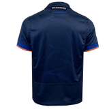 Back view of a dark blue Edinburgh 24/25 Replica Home Jersey by Macron featuring orange accents and a subtle wave pattern. Designed by Macron, the collar proudly displays "Built on Seven Hills".