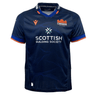 The Edinburgh 24/25 Replica Home Jersey by Macron is a home jersey in navy blue with bold orange accents, showcasing the Edinburgh logo and "Scottish Building Society" sponsor.