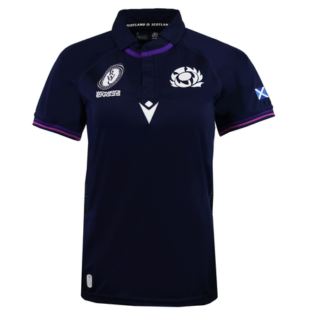 The Women's Scotland WRWC25 Replica Home Jersey by Macron features navy blue with white and purple trim, plus the Scottish Rugby logo and flag on the sleeve. Official women's home jersey for WRWC25. Brand: Macron.