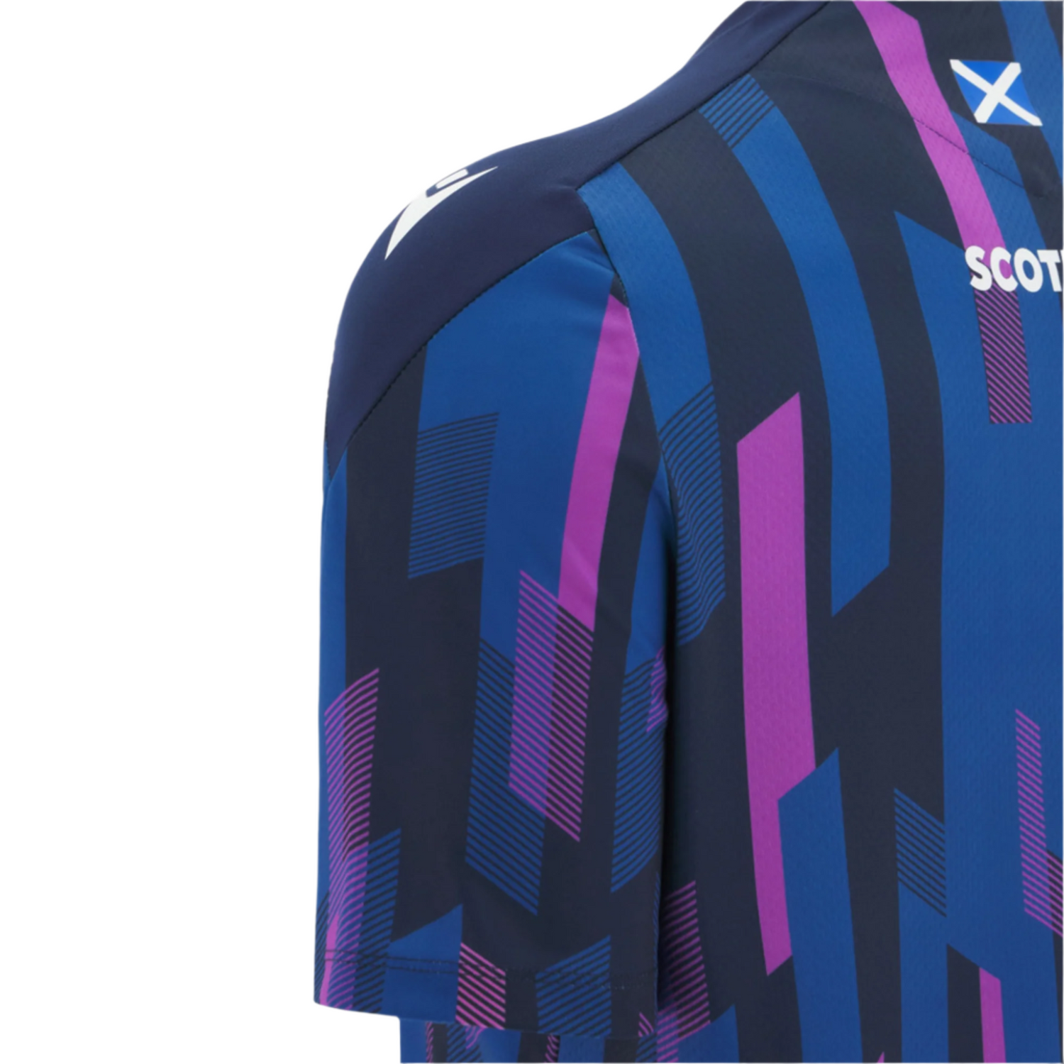 Close-up of the Scotland 25/26 Player Warm-Up Shirt by Macron, featuring a blue and purple geometric pattern, partial "SCOT" text, and a small Scottish flag on the shoulder—ideal as an athletic performance shirt.