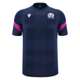 The Scotland 25/26 Player Training T-Shirt by Macron features a navy blue checkered pattern, white chest logos, and pink sleeve stripes—an ideal moisture-wicking sports tee for fans and athletes from Macron.