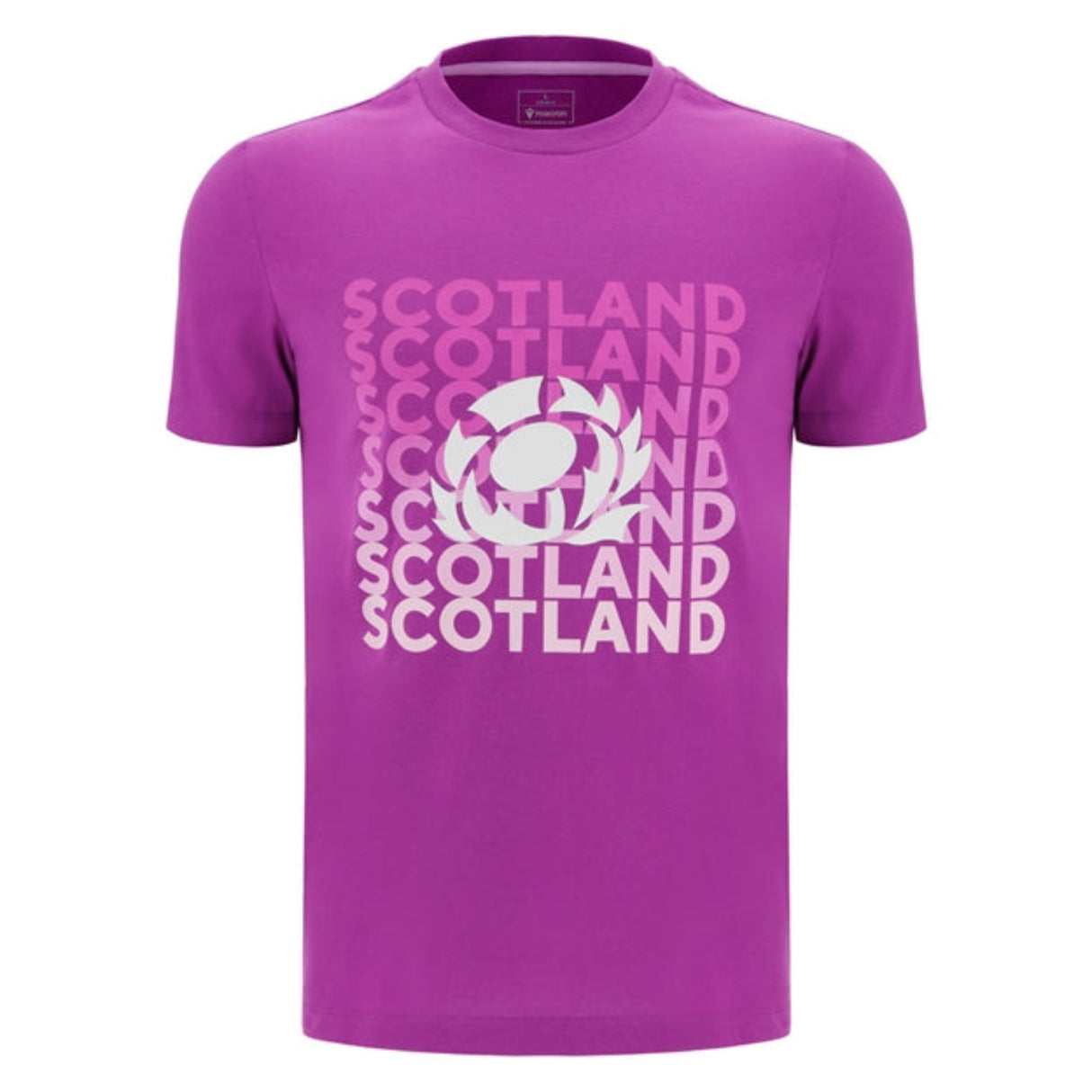 The Scotland 25/26 Leisure T-Shirt by Macron is a purple tee featuring "Scotland" repeated in white and pink text, plus a central thistle rugby emblem.