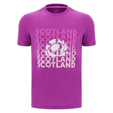 The Scotland 25/26 Leisure T-Shirt by Macron is a purple tee featuring "Scotland" repeated in white and pink text, plus a central thistle rugby emblem.