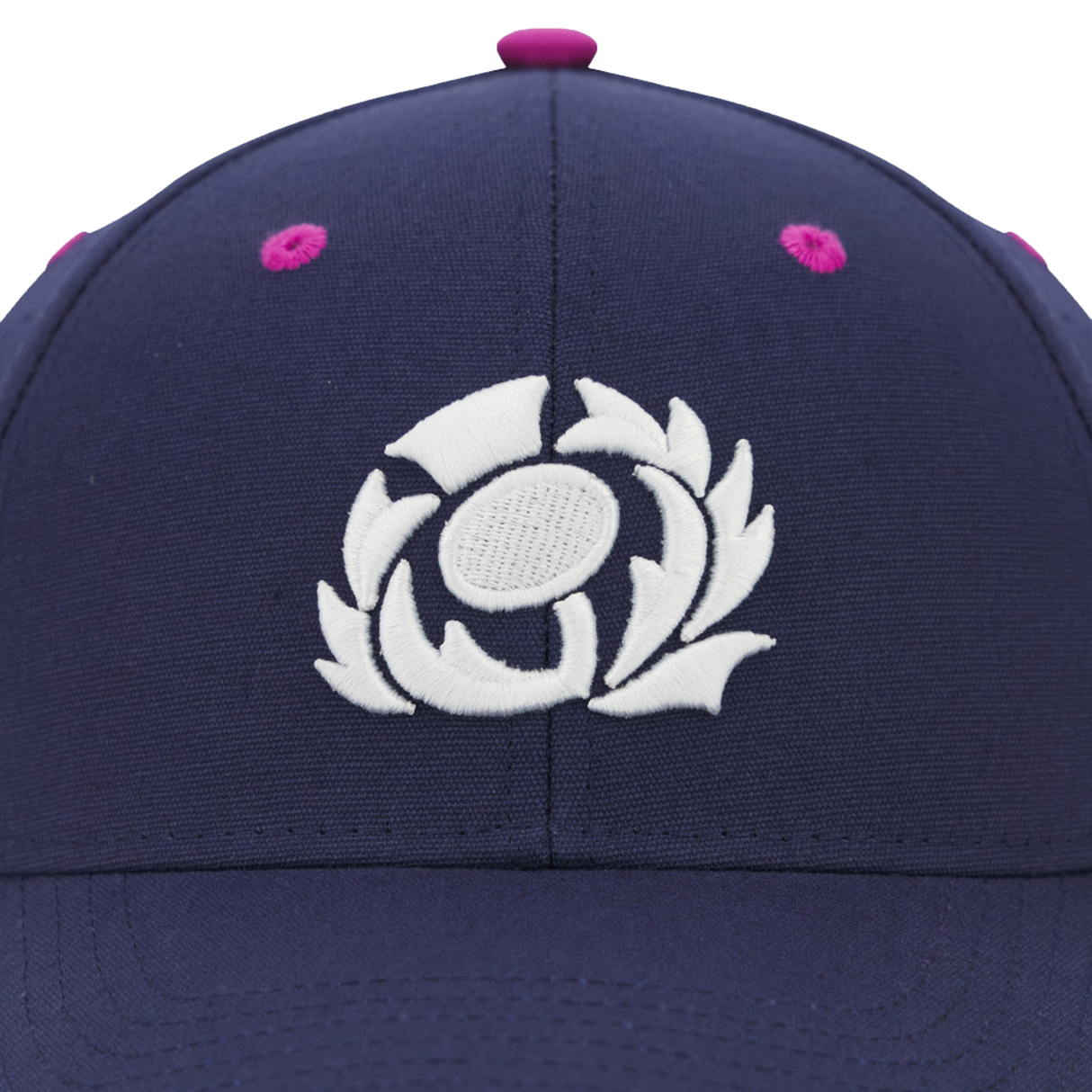 Close-up of the Scotland 25/26 Baseball Cap by Macron, in navy blue with a white embroidered thistle emblem on the front—a classic tribute to Scottish Rugby.