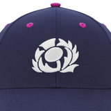 Close-up of the Scotland 25/26 Baseball Cap by Macron, in navy blue with a white embroidered thistle emblem on the front—a classic tribute to Scottish Rugby.