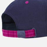 Close-up of the back of the Scotland 25/26 Baseball Cap by Macron, a navy blue cap with a pink plaid adjustable strap and a plastic buckle embossed with the Macron logo.