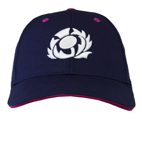 The Scotland 25/26 Baseball Cap by Macron is a navy blue cap with a white embroidered spiral on the front, pink accents on the rim and eyelets, blending modern style with Scottish Rugby heritage.