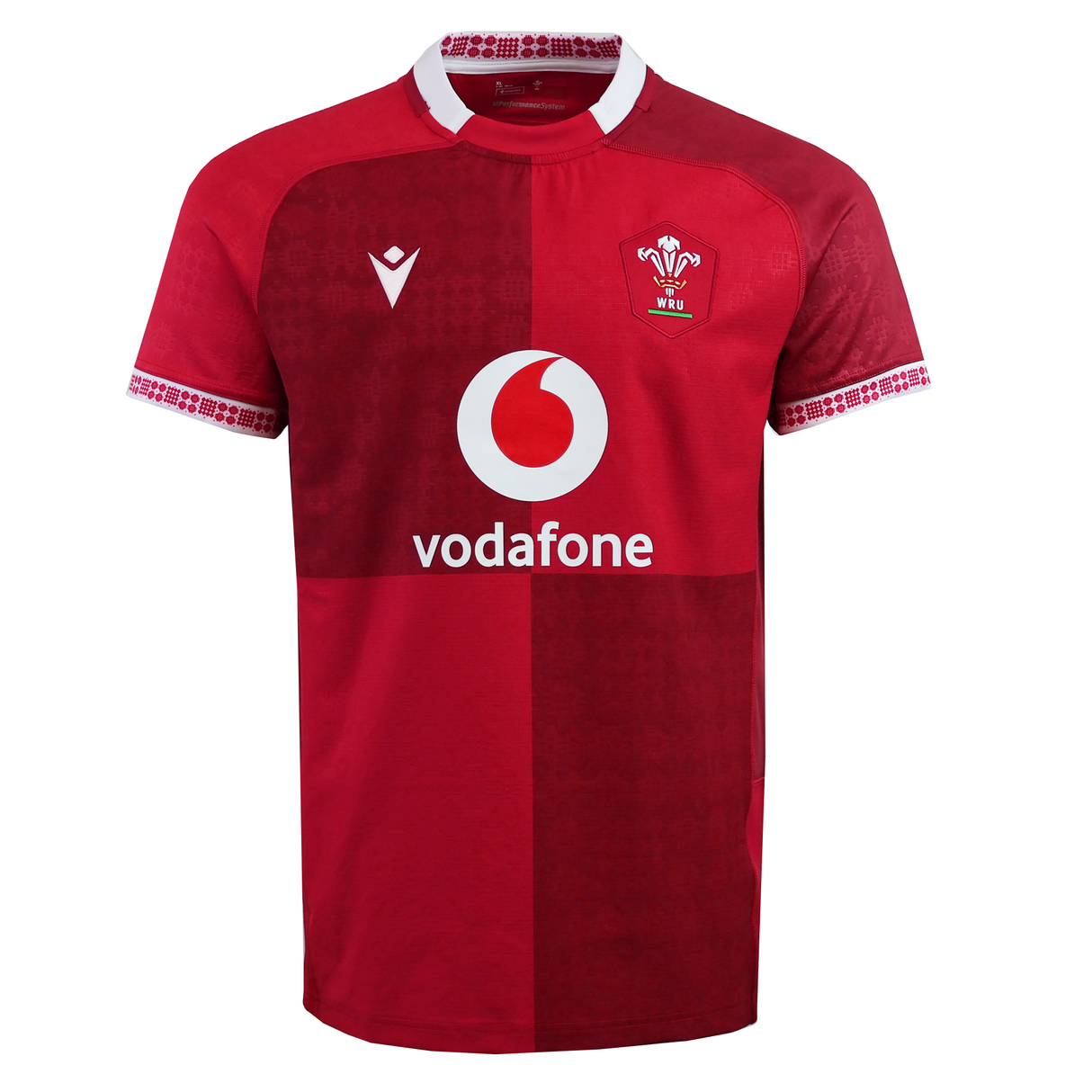 The Wales 25/26 Authentic Matchday Home Jersey by Macron is a red rugby shirt featuring the WRU match logo, Vodafone sponsor, and white collar detail.