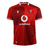 The Wales 25/26 Replica Home Jersey by Macron is a red rugby shirt with white patterned collar and sleeve trim, featuring the Vodafone sponsor logo and WRU crest—an authentic Macron design for Wales Rugby fans.