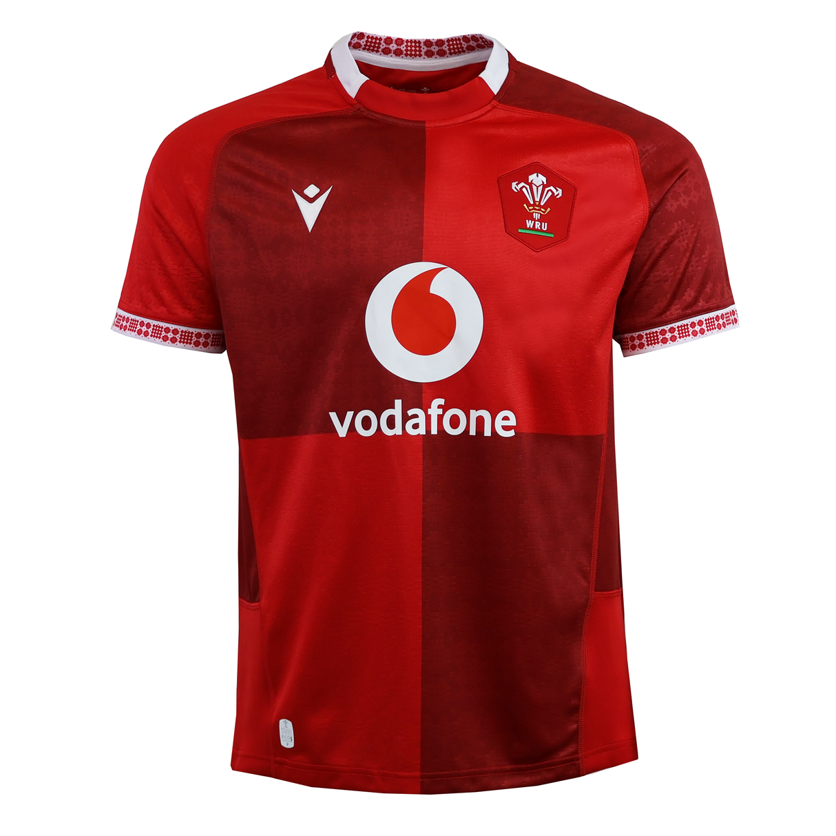 The Wales 25/26 Replica Home Jersey by Macron is a red rugby shirt with white patterned collar and sleeve trim, featuring the Vodafone sponsor logo and WRU crest—an authentic Macron design for Wales Rugby fans.