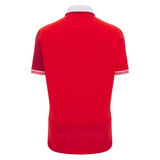 The back of the Wales 25/26 Replica Home Cotton Jersey by Macron features a red design with a white collar, patterned sleeve cuffs, and subtle "CYMRU" at the hem, blending classic style in this official WRU Macron replica shirt.