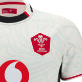 Close-up of the Wales 25/26 Replica Away Jersey by Macron, showcasing the WRU logo, abstract line patterns, and a red sponsor logo—a top-performance away rugby shirt crafted for style by Macron.