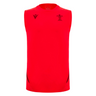 The Wales 25/26 Player Training Singlet by Macron is sleeveless and bright red, featuring black logos, accents, the WRU crest on the left chest, and a Macron logo on the right chest.