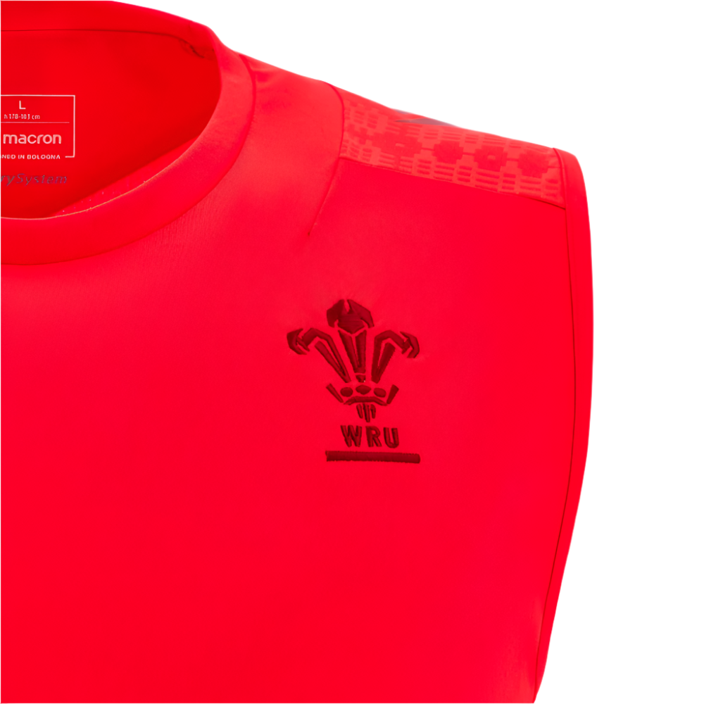 Close-up of the Wales 25/26 Player Training Singlet by Macron in red, featuring the WRU logo and Macron branding on the collar, made from performance polyester for enhanced comfort.