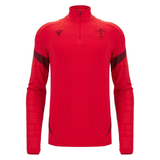 The Wales 25/26 Player 1/4 Zip Top by Macron is a red long-sleeve top featuring the Welsh Rugby Union logo and black accents on the shoulders and forearms.