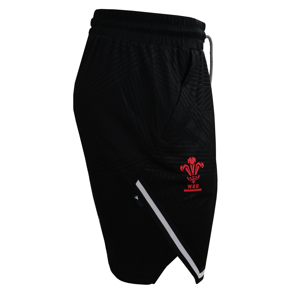 The Wales 25/26 Basketball Shorts by Macron feature an athletic fit, elastic waistband, red WRU logo on the left leg, and a diagonal white stripe near the hem. Stylish black Macron shorts ideal for Wales basketball fans. Displayed on a white background.