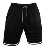 The Wales 25/26 Basketball Shorts by Macron feature a black athletic fit, white drawstring, subtle leaf pattern, white leg trim, and a small red logo on the left thigh. Inspired by classic WRU basketball shorts.