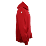 Wales 25/26 Welsh Rugby Cotton Fan Hoodie by Macron, shown from the side. Red hoodie with a front pocket, small white sleeve logo, and partial white chest text—classic Welsh Rugby style.