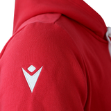 Close-up of the Wales 25/26 Welsh Rugby Cotton Fan Hoodie by Macron in red, featuring a white embroidered logo on the shoulder.