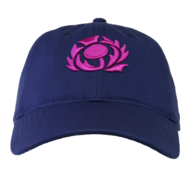 The Scotland 25/26 Dad Cap by Macron is navy blue and features a bright pink embroidered circular thistle floral logo on the front.