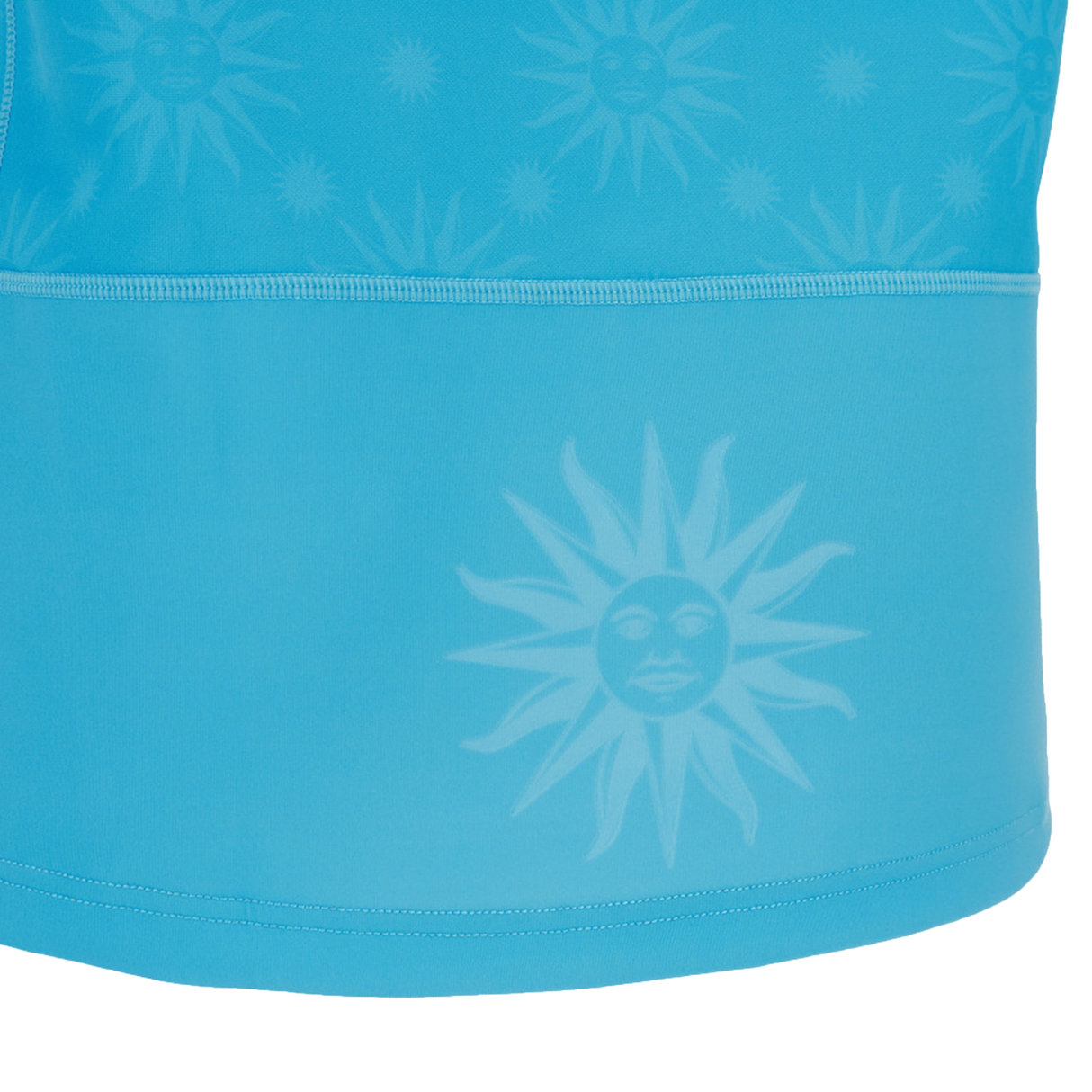 Close-up of the blue Uruguay URU 25/26 Replica Home Jersey by Macron, featuring a repeating sun face pattern, intricate stitching, and a prominent sun face near the bottom hem.