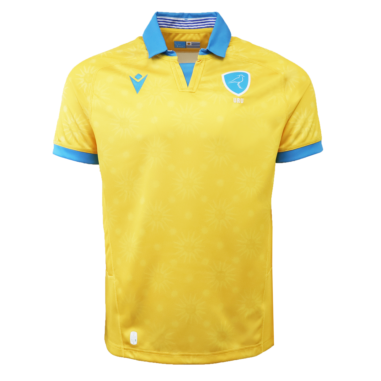 The Uruguay URU 25/26 Replica Away Jersey by Macron is a yellow short-sleeve jersey with blue cuffs and collar, made from EcoFightex fabric, featuring a sunburst pattern and a blue crest with bird and "URU" on the chest.