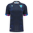 The Uruguay URU 25/26 Replica Training Jersey by Macron features short sleeves, dark blue color with subtle patterns, and light blue URU and Macron logos on the chest.