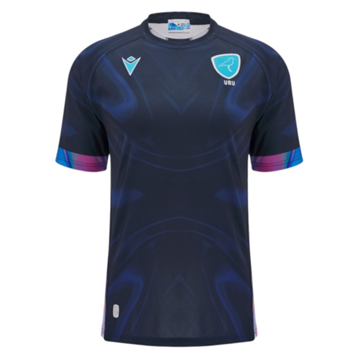 The Uruguay URU 25/26 Replica Training Jersey by Macron features short sleeves, dark blue color with subtle patterns, and light blue URU and Macron logos on the chest.