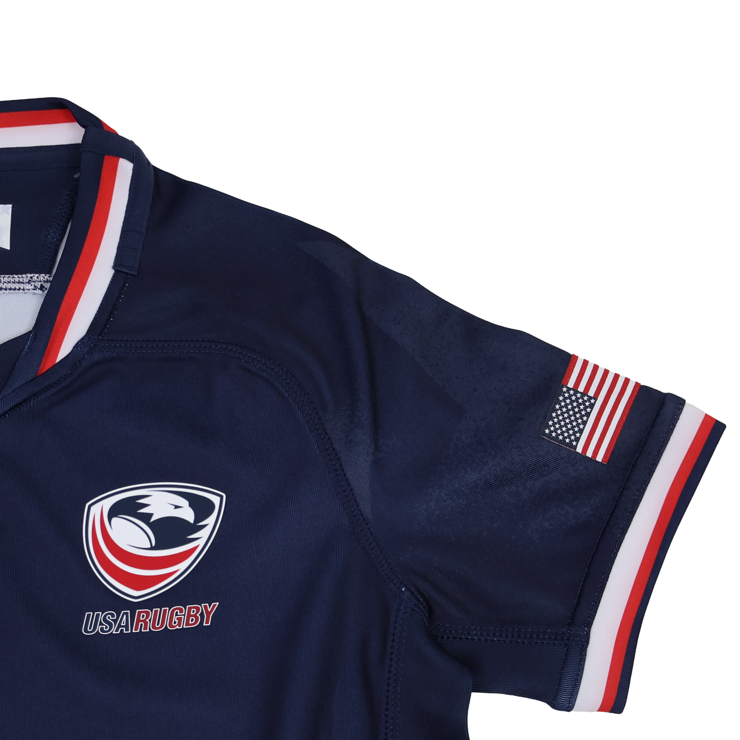 The Youth USA Rugby 24/25 Home WRWC Jersey by Macron features the team's logo on the chest, a small American flag patch on the sleeve, and red, white, and blue trim—perfect for young rugby fans.