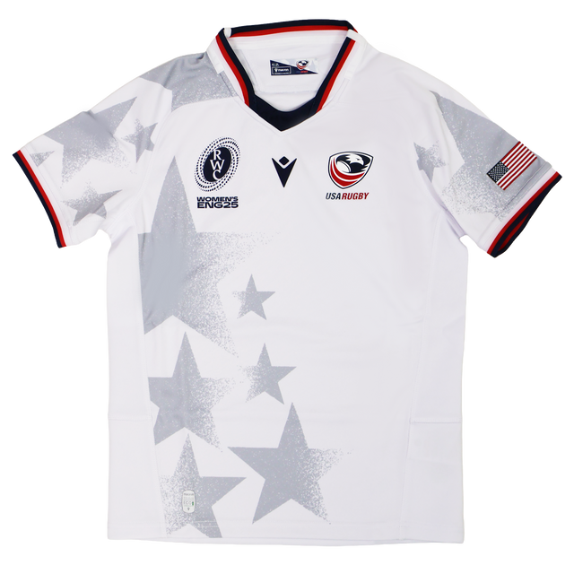 The Youth USA Rugby WRWC 25 Home Jersey by Macron features gray star patterns, the "USA Rugby" logo, WRWC 25 emblem, American flag patch, plus red, white, and blue trim on the sleeves and collar.