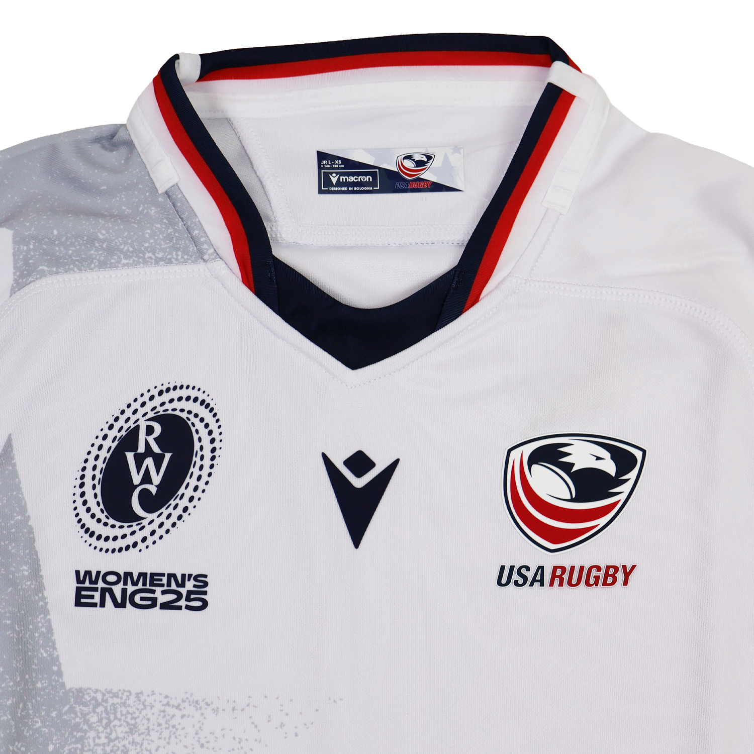 The Youth USA Rugby WRWC 25 Home Jersey by Macron features the USA Rugby eagle, WRWC 25 logo for Rugby World Cup Women’s England 2025, and red, navy, and gray collar accents.