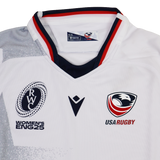 The Youth USA Rugby WRWC 25 Home Jersey by Macron features the USA Rugby eagle, WRWC 25 logo for Rugby World Cup Women’s England 2025, and red, navy, and gray collar accents.