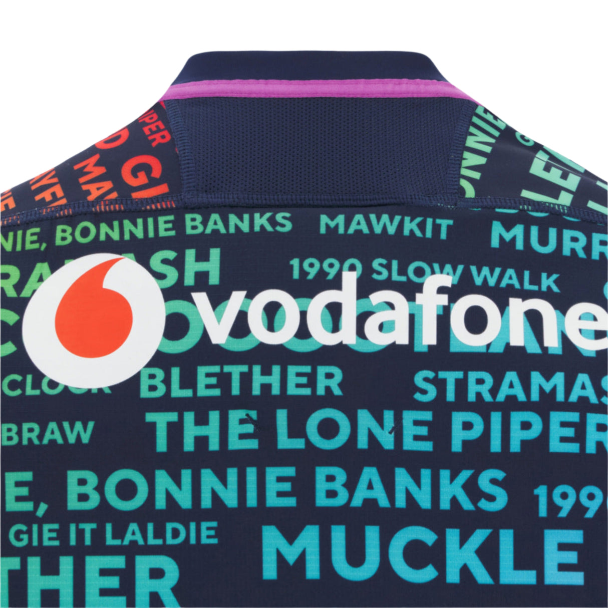 Back of the Scotland 25/26 Rainbow Training Jersey by Macron, displaying the Vodafone logo and vibrant Scottish phrases, celebrating team spirit.