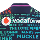 Back of the Scotland 25/26 Rainbow Training Jersey by Macron, displaying the Vodafone logo and vibrant Scottish phrases, celebrating team spirit.