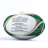 A Gilbert Springboks Rugby World Cup 2023 Champions Ball displaying match results and the progression of South Africa in the tournament.