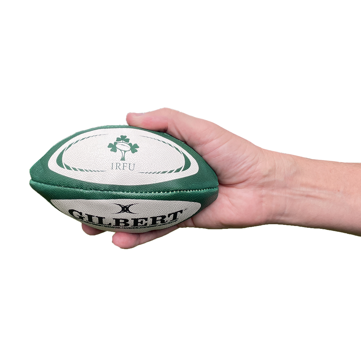 A hand holds the Ireland Mini Replica Ball by Gilbert, featuring the IRFU logo and Gilbert branding, set against a clean white background.