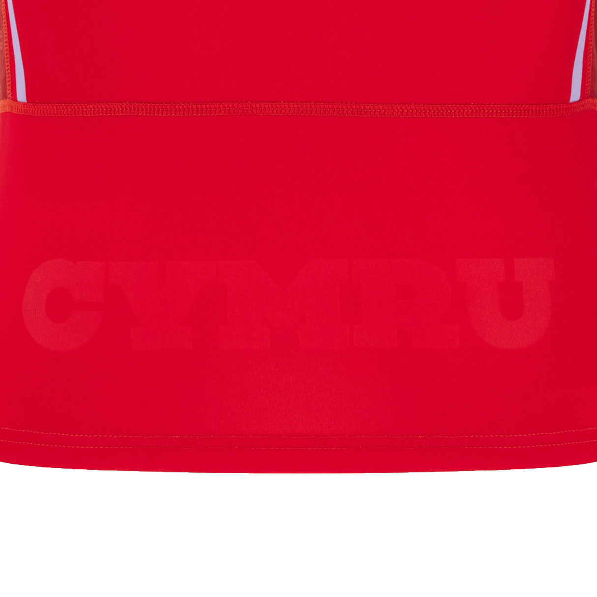 A close-up of the Women's Wales WRWC25 Replica Home Jersey by Macron in red, featuring "CYMRU" printed boldly near the bottom.
