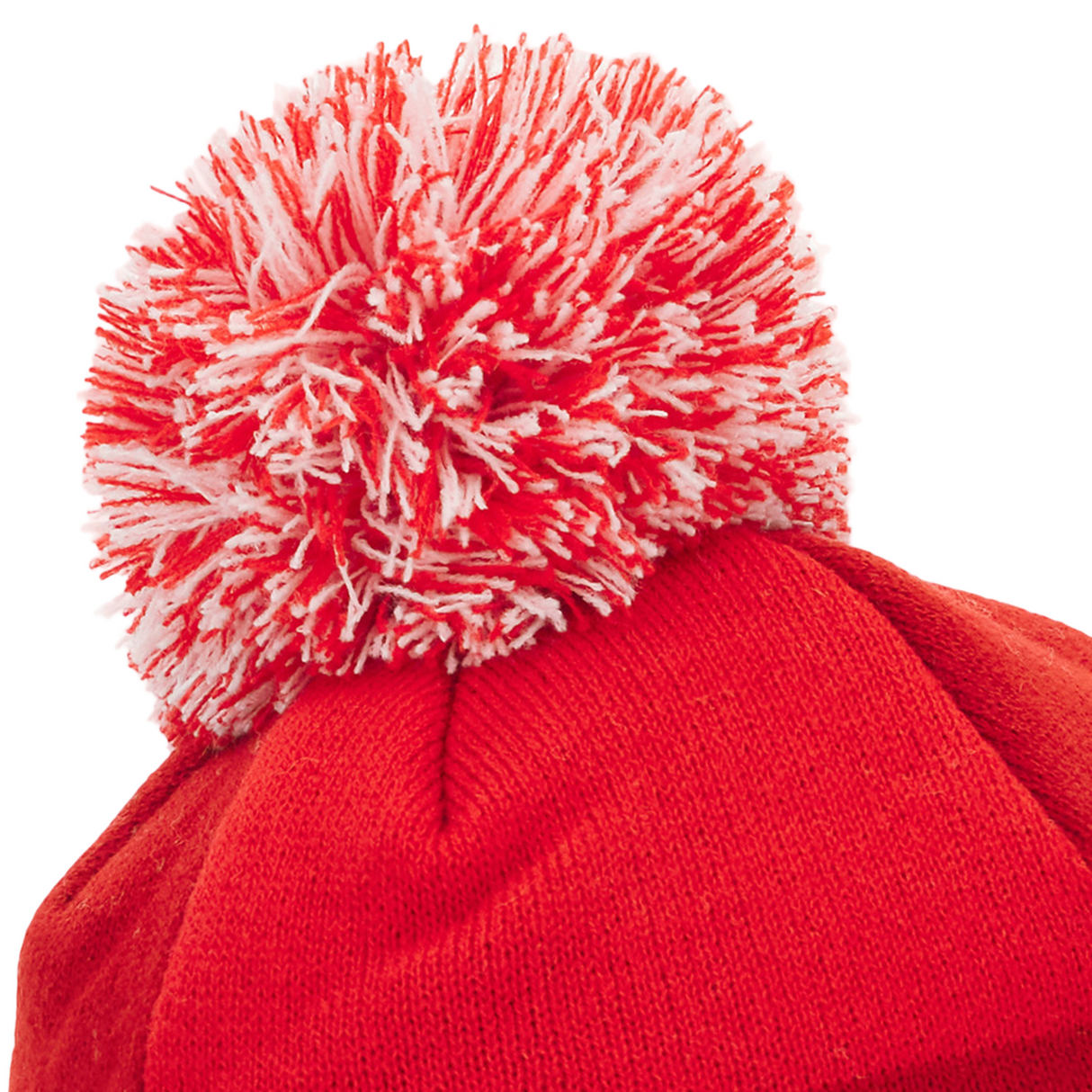 A close-up of the Wales 25/26 Pom-Pom Beanie by Macron, a red knit hat with a bold red and white pom-pom, perfect for Welsh Rugby Union fans seeking cozy winter style.