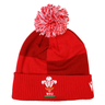 Show your support on match day with the Wales 25/26 Pom-Pom Beanie by Macron—a red knit beanie with a white and red pom-pom, featuring the WRU logo on the cuff.