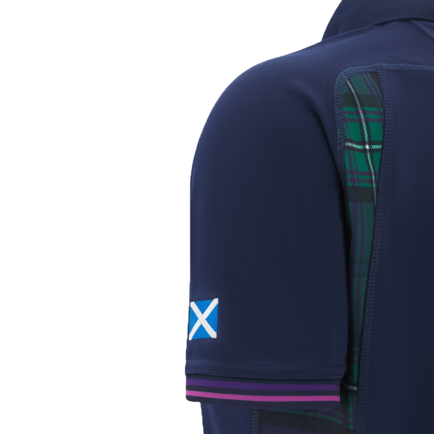 Close-up of the Women's Scotland WRWC25 Replica Home Jersey by Macron, showing a navy sleeve with a Scottish flag patch and green tartan detail—design inspired by the Rugby World Cup jersey.