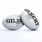 Two Gilbert Original Barbarian Match Balls with the brand name Gilbert on them.
