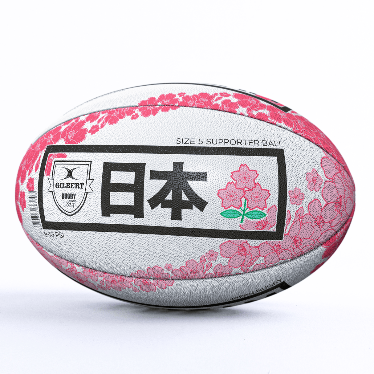 A **Japan Supporters Ball by Gilbert** adorned with pink floral designs and Japanese characters. The text includes "Japan Supporters Ball" and "Size 5 Supporter Ball," celebrating the Brave Blossoms. The iconic **Gilbert** logo is also prominently displayed.