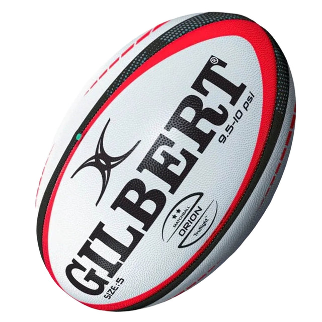 A Gilbert Orion Match Ball in white with red and black accents, featuring the Gilbert brand name, logo, and “9.5-10 PSI” marking, designed as an official match rugby ball for superior performance.