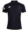The Dallas Harlequins Lions Origin Waimak Polo by EMB Canterbury is a black short-sleeved rugby polo with a collar, white Canterbury logo, embroidered crest, "Lions" patch on the left sleeve, and is made from a cotton-polyester blend.