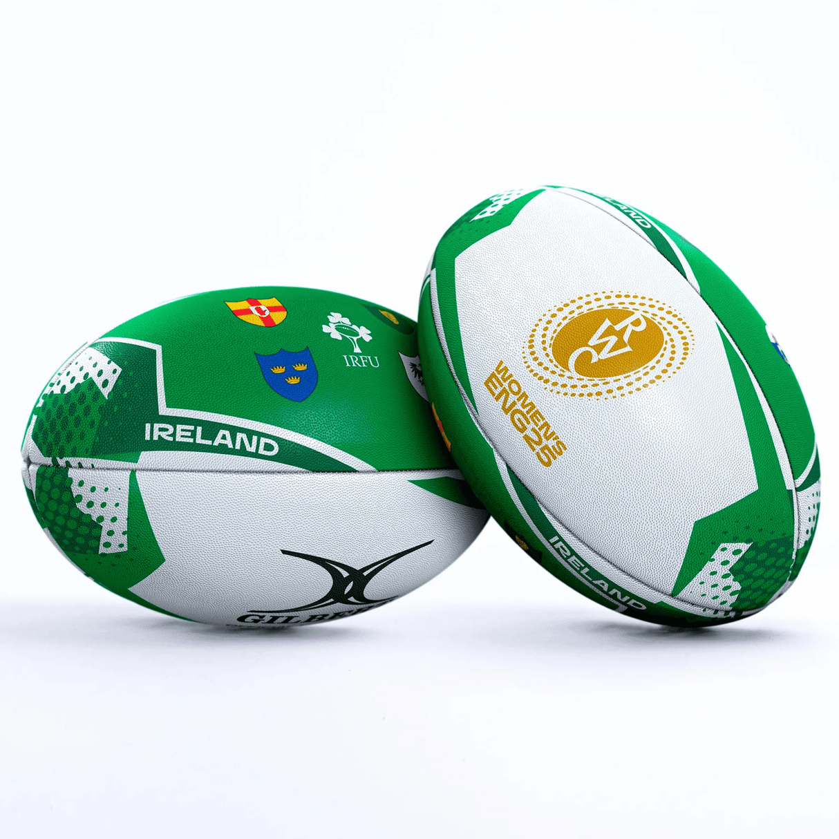 Two Women's Rugby World Cup 25 Ireland Team Balls by Gilbert, in green and white with crests, "Ireland" text, Gilbert branding, and event logos are shown—one upright and one lying down on a white background.