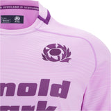 Close-up of the Scotland 25/26 Replica Away Jersey by Macron, highlighting the Scottish Rugby logo, partial purple sponsor text, and quality detailing. This official away jersey displays vibrant team pride and expert craftsmanship from Macron.